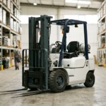 Forklift parked in a warehouse aisle between tall racking